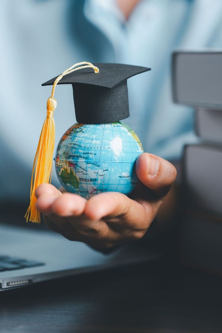 Graduation cap on globe representing study abroad application process